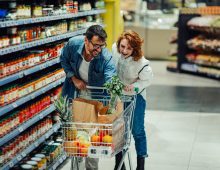 happy-couple-shopping-for-groceries-in-supermarket-2026-01-09-09-42-26-utc